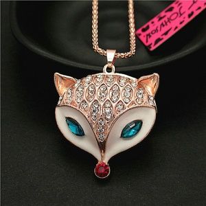 THIS IS A FOX HEAD NECKLACE IN LIGHT BRONZE, BLUE